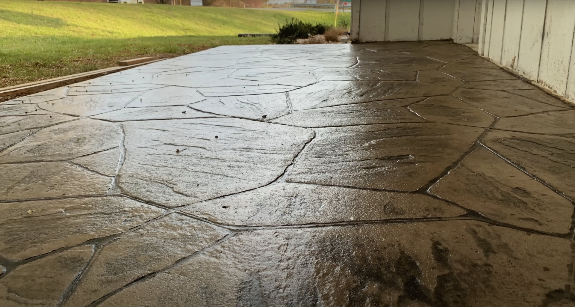 Concrete driveway repair and maintenance services needed Concrete driveway with decorative stamped pattern showing signs of wear