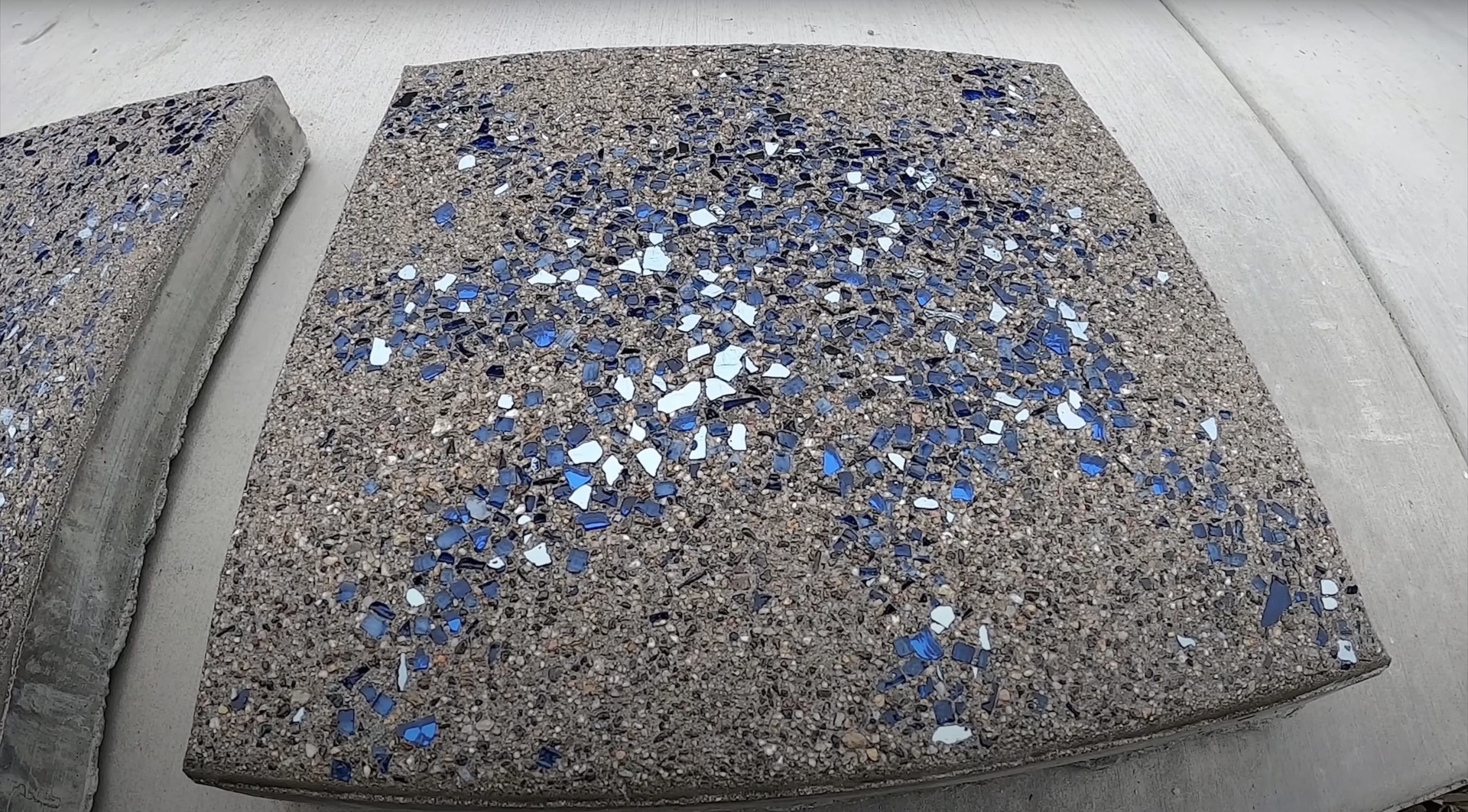 Stamped and decorative concrete services Decorative concrete with blue and white aggregate finish