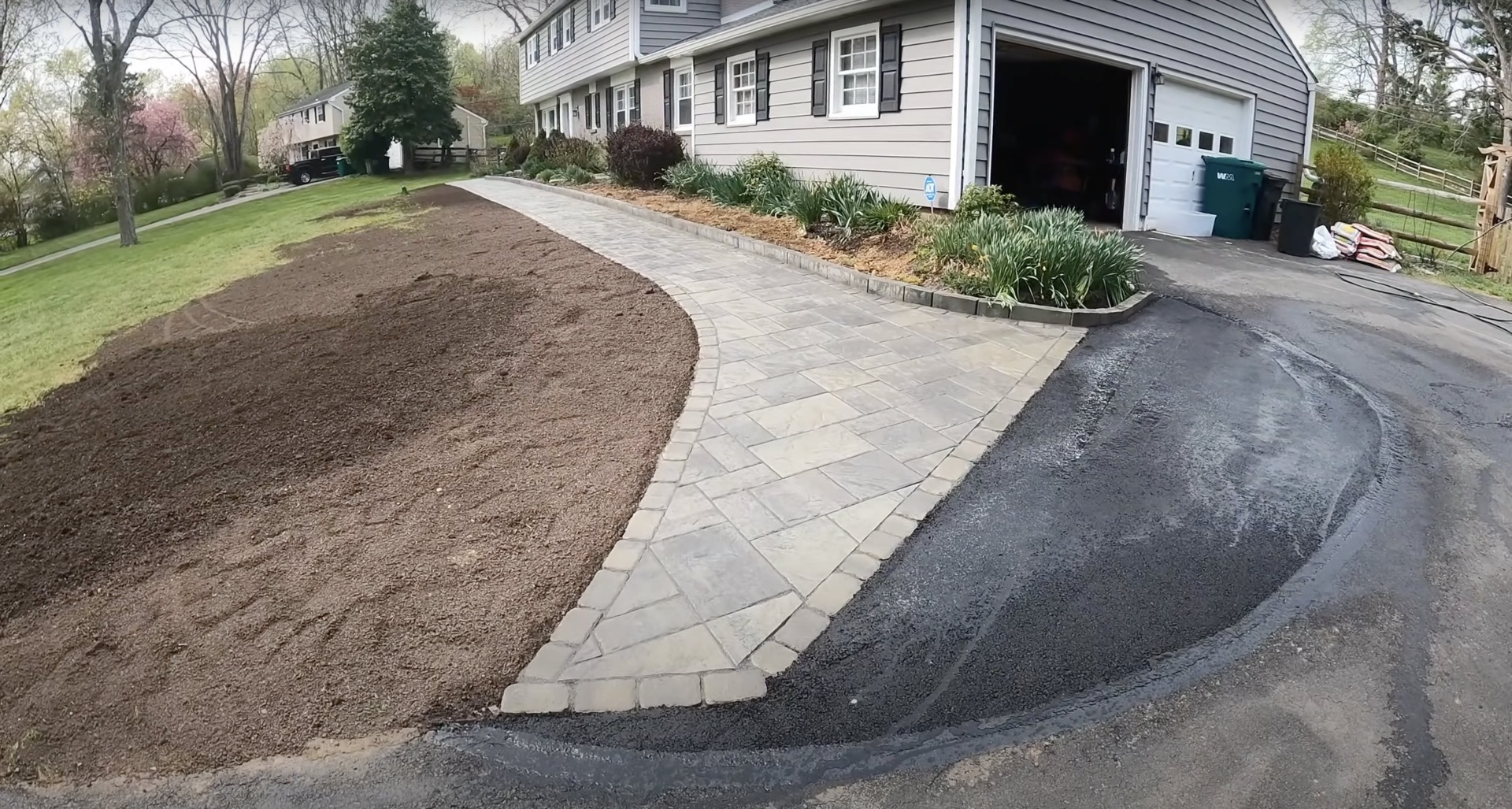 Concrete and paver walkway installation services Paver and concrete walkway installation connecting driveway to home entrance